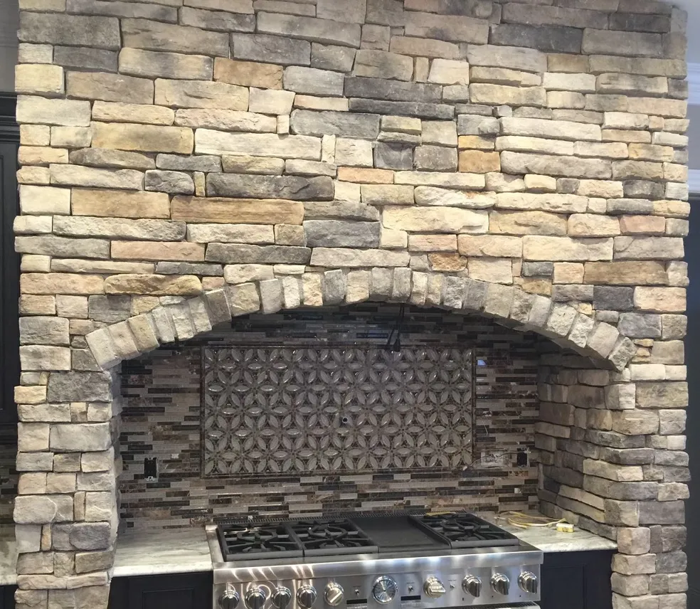 Stonework around stove area in a kitchen remodel renovation project