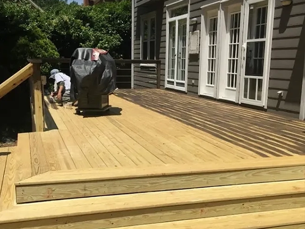 wooden deck built by porch, patio, and deck construction service